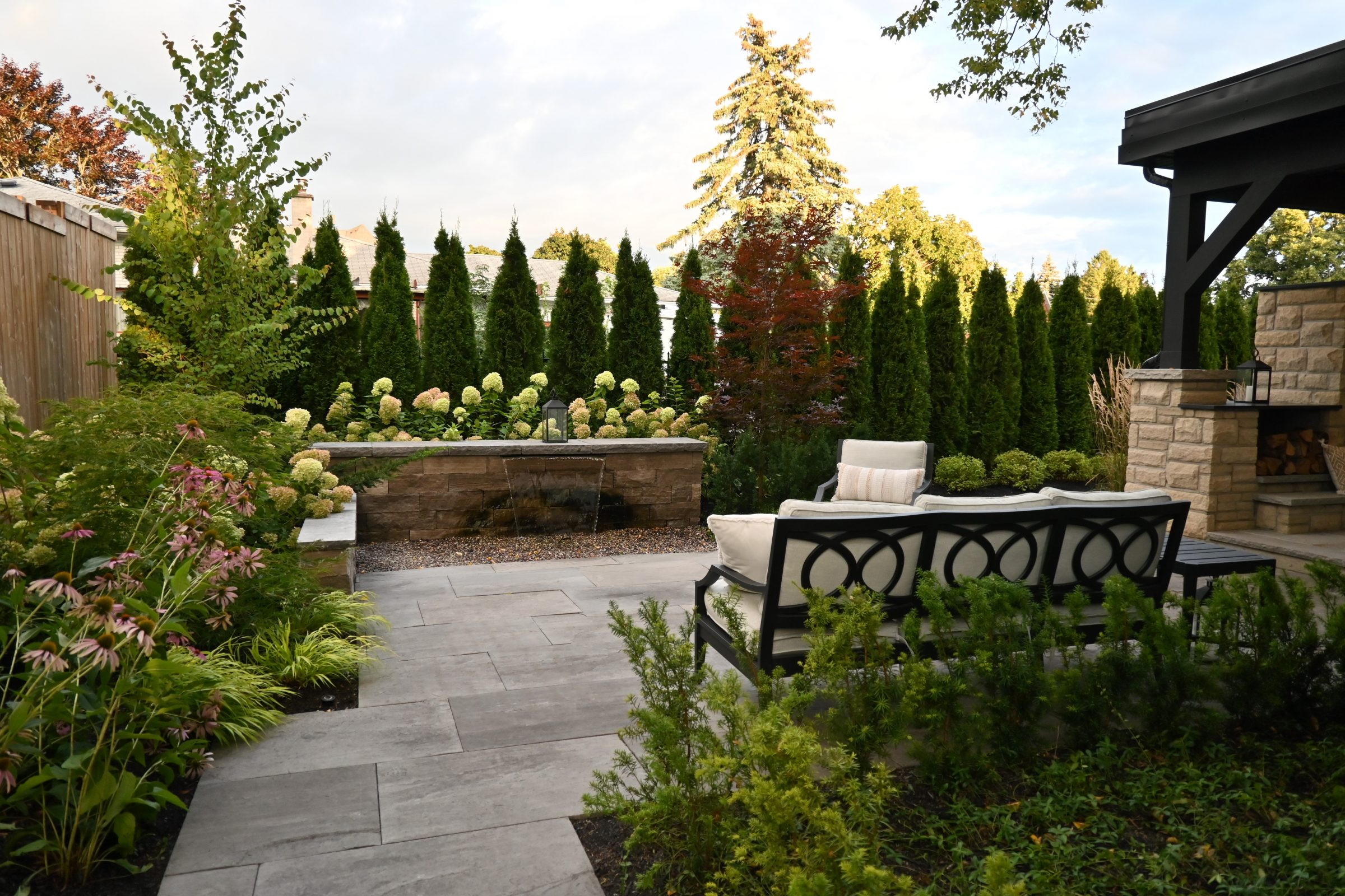 Beautiful backyard with garden and comfortable seating area.