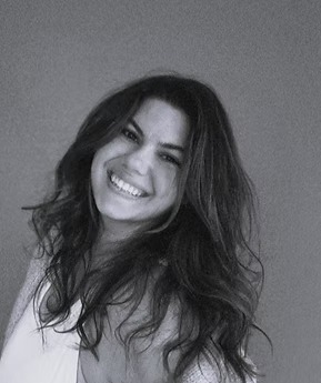 Woman smiling in black and white portrait