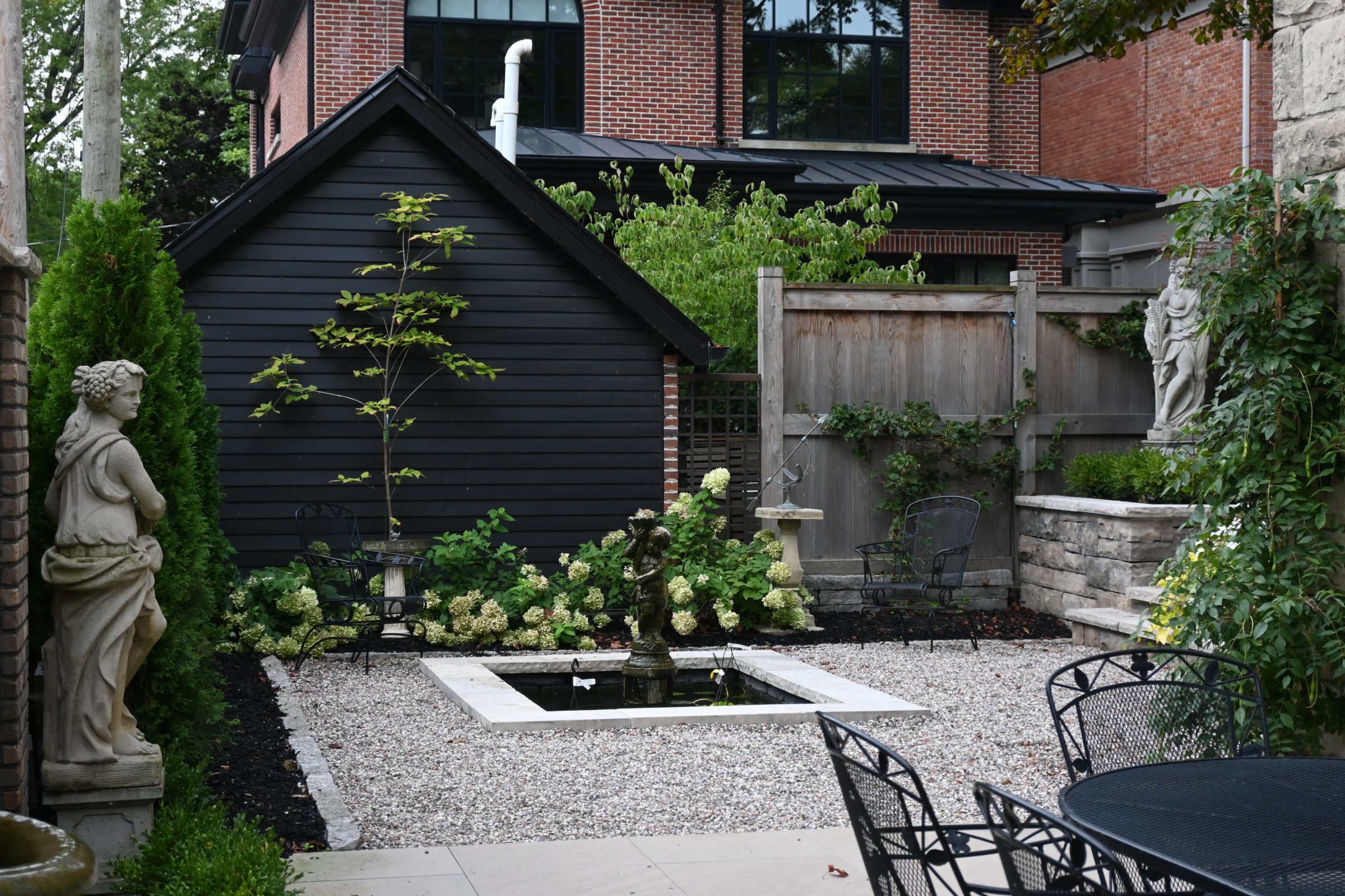 Serene garden with statues and fountain