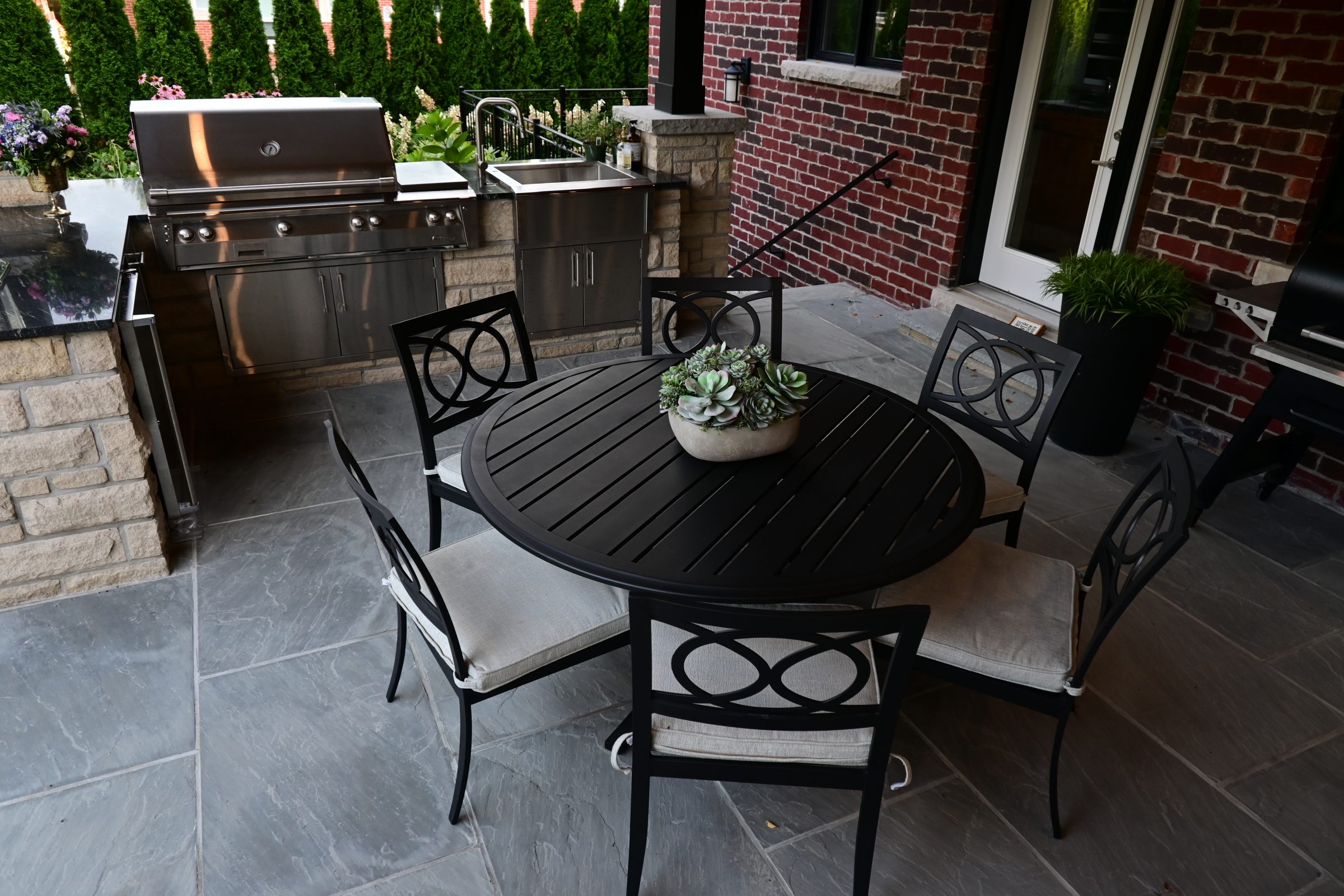 Outdoor patio with grill and dining set