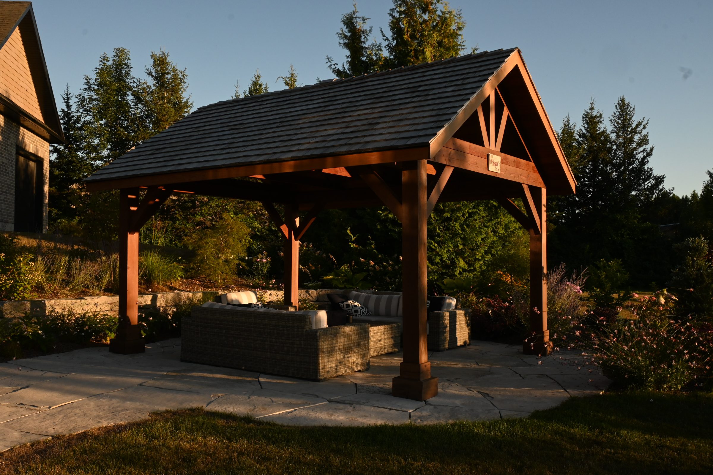 Outdoor pavilion with seating in garden