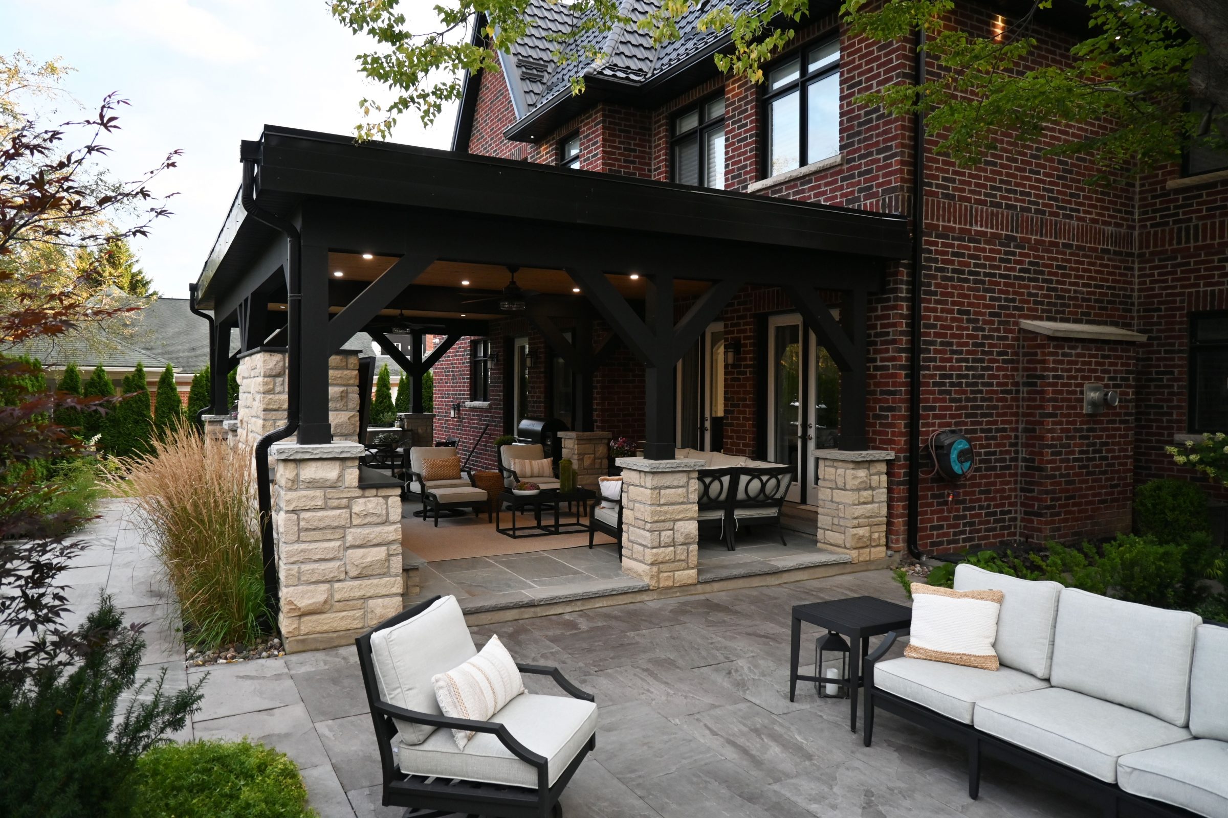Cozy outdoor patio with furniture and greenery