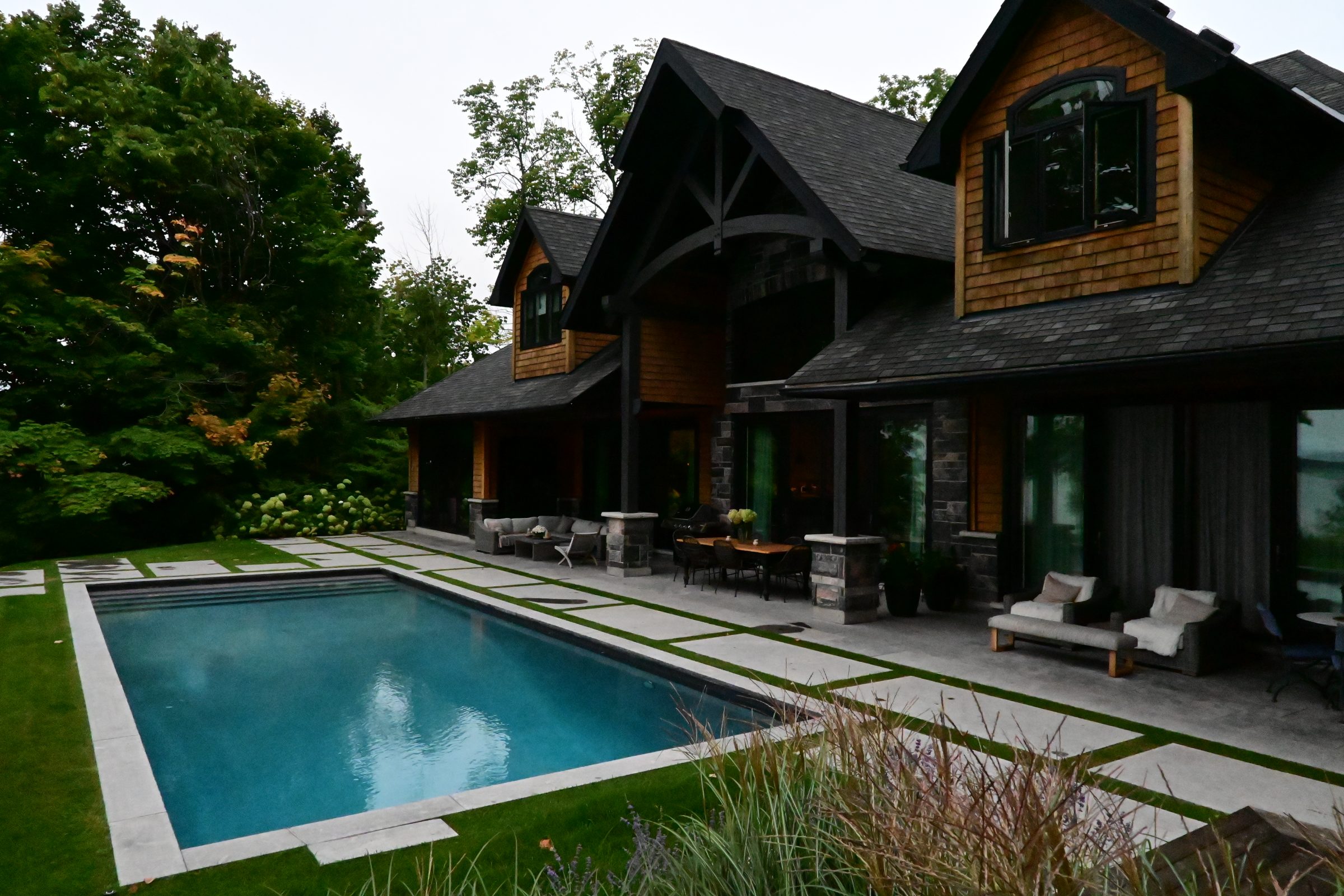 Modern house with backyard pool and garden