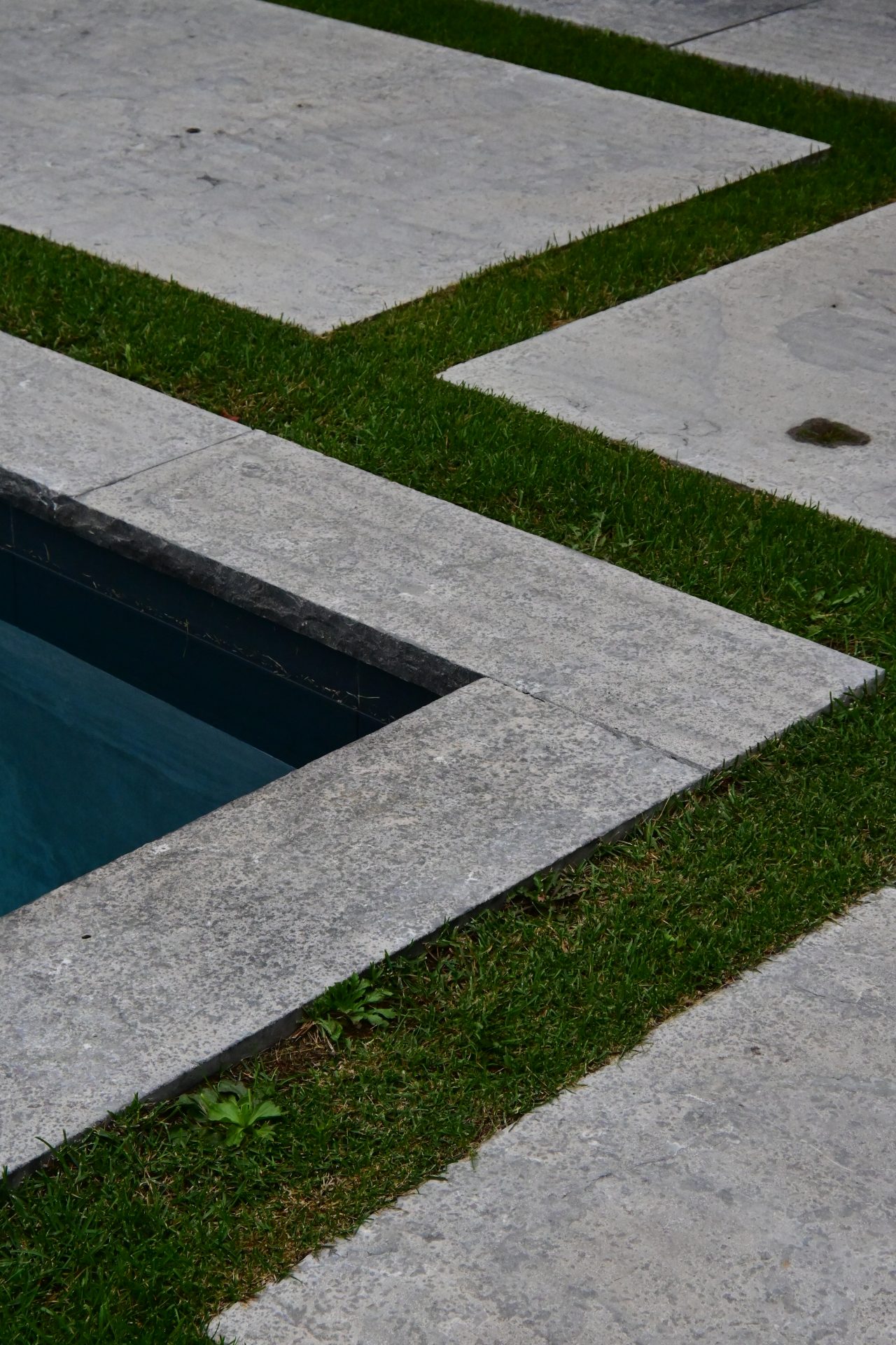 Stone path with grass and water feature