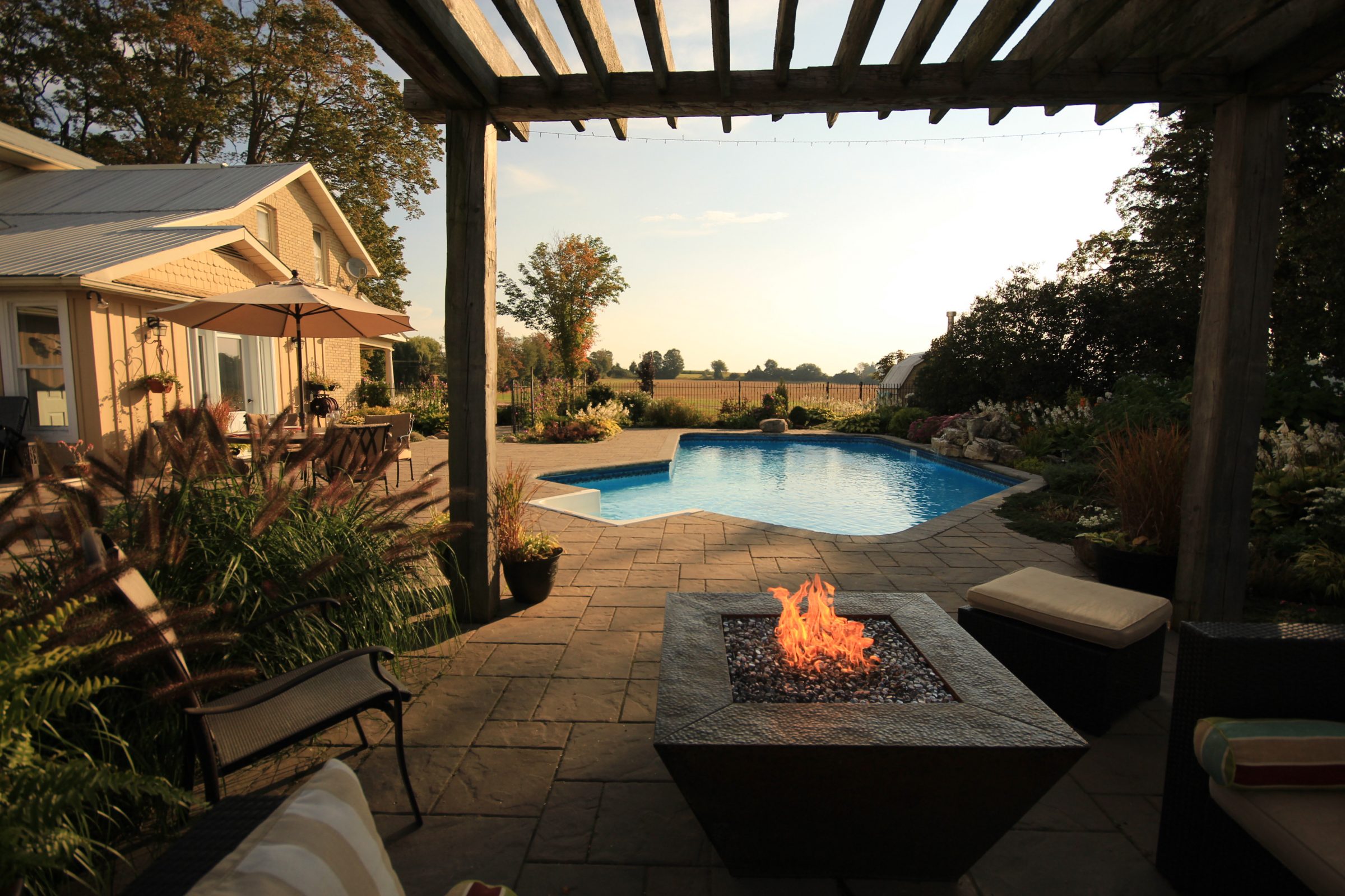 Cozy backyard with pool and fire pit