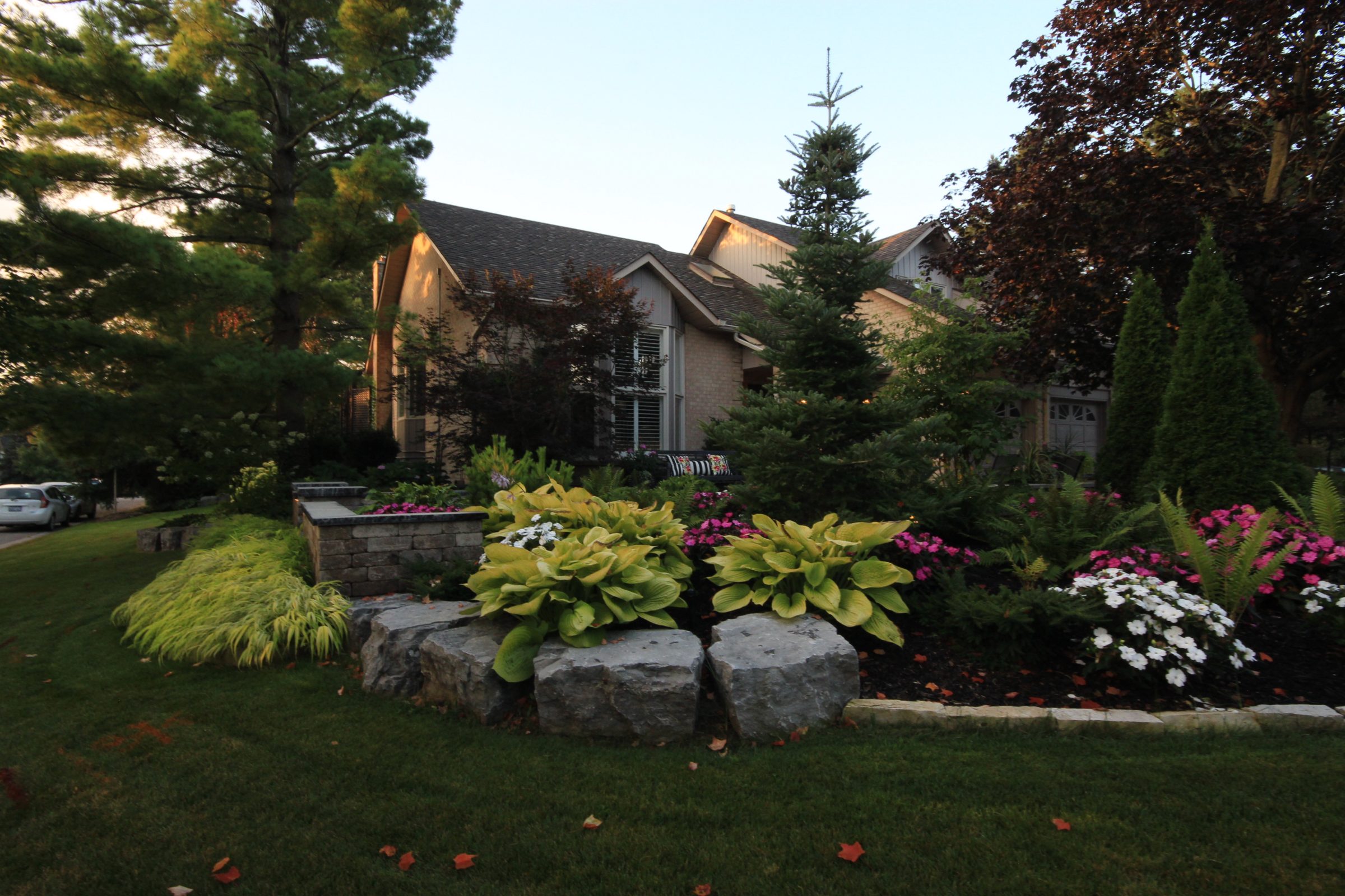 Beautiful house with landscaped garden and colorful flowers.