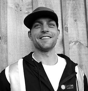 Smiling man in cap and jacket